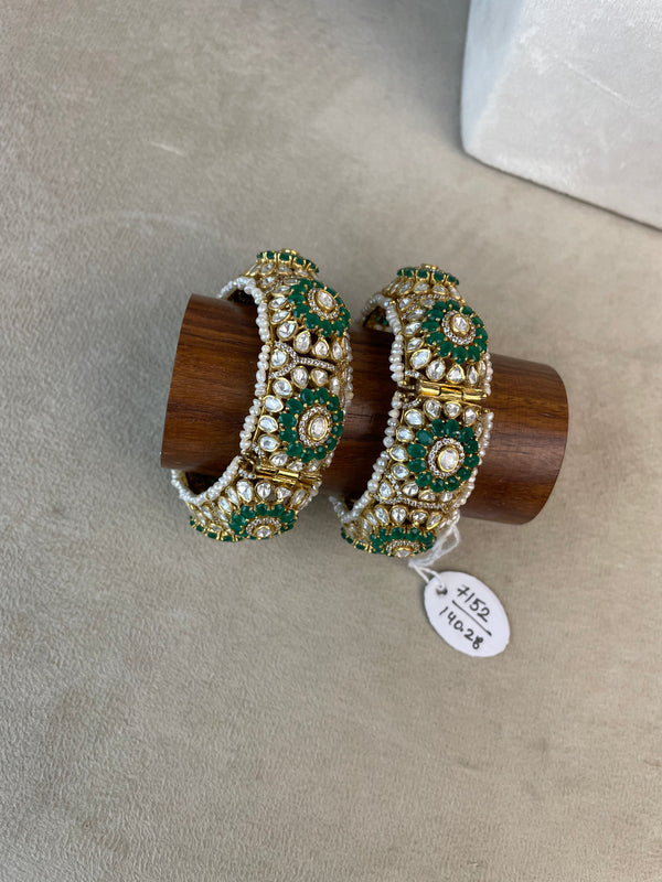 Pannali Bangles with green and white stone detailing and gold-toned floral design.