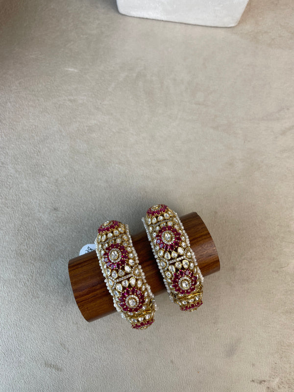 Rajraani Bangles with white stones, pink detailing, pearl borders, and a gold-toned floral design